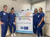 Columbia Nursing students at a global site standing next to a sign